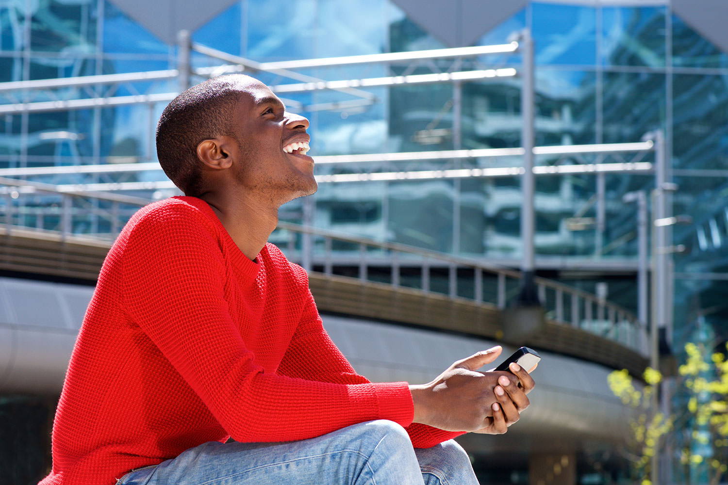 man in red shirt smiling