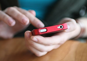 Red phone and two hands