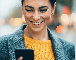 Woman on phone recieving a message